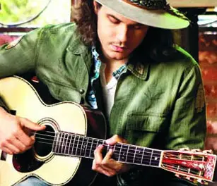 John Mayer playing a Martin parlor guitar